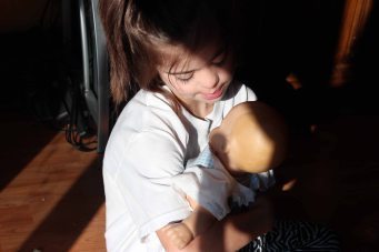 J and doll