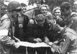 Troops of US 101st Airborne Division receiving information from Dutch resistance members, Eindhoven, the Netherlands, September 1944 (US National Archives)