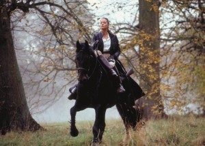 Note how she's sitting side-saddle