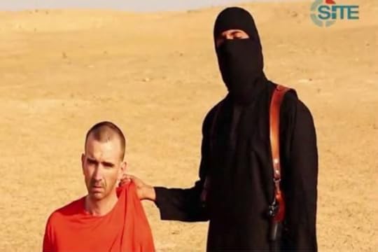 An image grab taken from a video released by the Islamic State (IS) and identified by private terrorism monitor SITE Intelligence Group on Sept 2, 2014 purportedly shows footage of a masked militant in a desert landscape threatening to kill British David Haines. - AFP