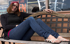 Woman sitting on park bench