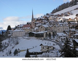stock-photo--village-in-italian-alps-against-blue-sky-46117540