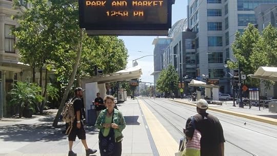 Waiting for the trolley. The large dome behind me is the new San Diego Public Library