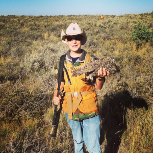 Brigham shows off his first sage grouse. Somehow that cowboy hat just seems to work for sage grouse hunting. 