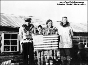 Alaska Natives, like Henry Lockwood and his family from Unalakleet, eagerly volunteered to serve in the Alaska Territorial Guard during World War II. Mrs. Lockwood handmade the American flag they are displaying in this photo.