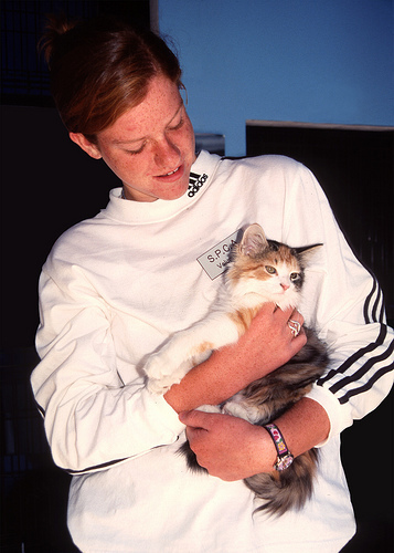 shelter volunteer with kitten