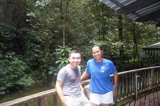 Maria Easters Sylvester, a guide from Kuching I made friends with, and I in the picnic area beside the Clearwater River.