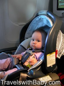 baby flying rear-facing in car seat on airplane