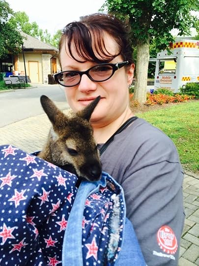 I just have to be sporting BAD hair when I hold marsupials. And what's up with the hippie purse again?