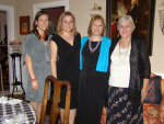With mom, sister, and daughter beside portrait of George Washington