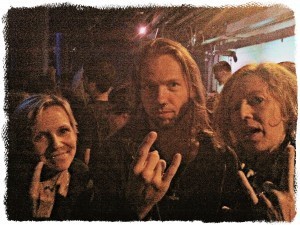 Mari and me with Tyr lead singer Heri Joenson, whose heavy metal salute is much more polished than ours