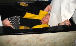 Dead-looking woman lies in bathtub