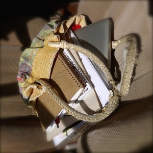 Bag overflowing with books and notebooks