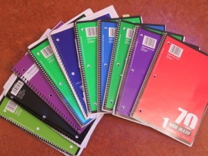 Christine's colored spiral-bound notebooks