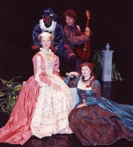 Two men and two women pose in Shakespearean costumes.