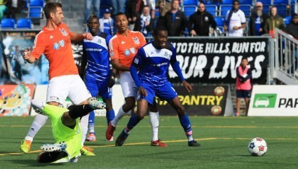 FCE's Tomi Ameobi (centre) gets set to celebrate as the ball slides by Carolina keeper Akira Fitzgerald. PHOTO: TONY LEWIS/FC EDMONTON