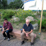 Meditating outside the tent on a stone bench
