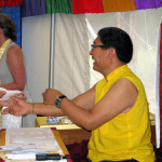 Rinpoche receiving katas and giving blessings to each participant