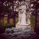 The archangel Michael stands guard against an insidious Satan above the grave of John M. Hay