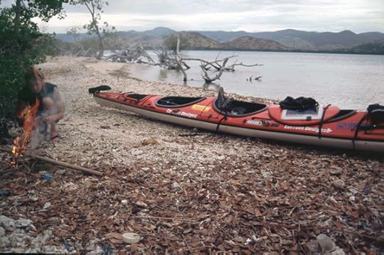April of Expedition 360 lights a fire on an islet north of Flores, Indonesia, which turned out to be infested with sea snakes