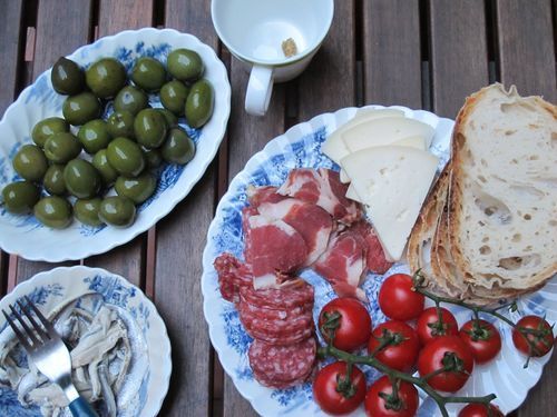 Picnic food. Okay, that's a lie: we didn't haul real dishes out to the park. This was a similar feast we had on our patio. But we did eat food just like this at the Borghese Gardens.