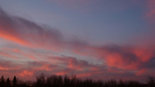 Clouds to the south reflecting the sunrise