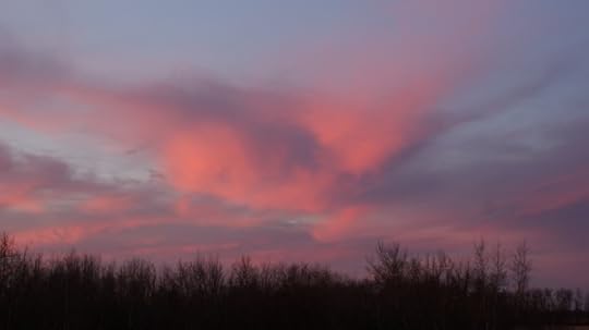 Clouds to the south west reflecting the sunrise