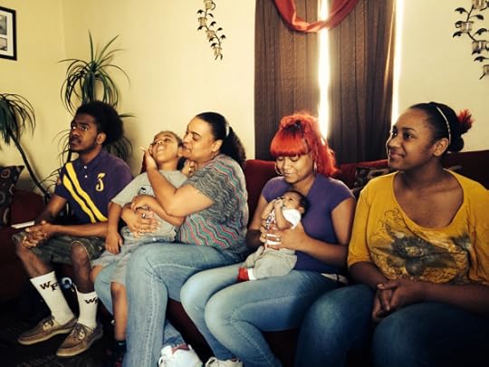 Shannon Huff, seated second from left, surrounded by her children and grandchild.
