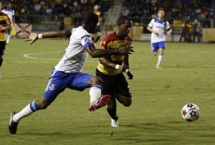 FC Edmonton's Tomi Ameobi, left, challenges Fort Lauderdale's Darnell King.