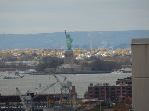 The Statue of Liberty faces Minerva from the harbor.