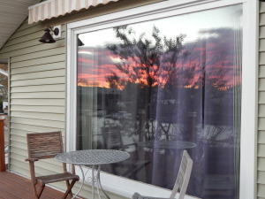 The sunset reflected into my deck window! I have endeavored to make every room one with a view.