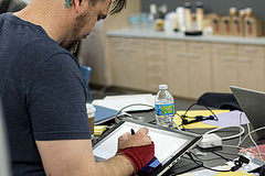 Artist Jacob Glaser working at the hackathon. Photo credit Jamais Cascio.