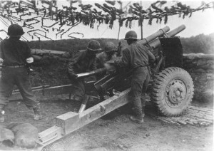 Japanese-American troops of US 442nd Regiment firing artillery to support Allied ground movements, Bruyeres Sector, France, 18 October 1944 (Hawaii War Records Depository)