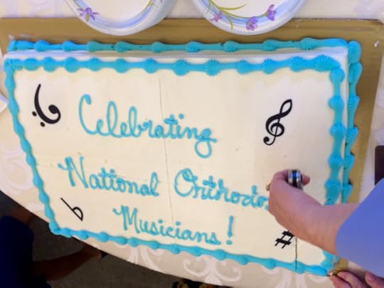 Here's a cake about to be cut. You can see the cross marked into the top.