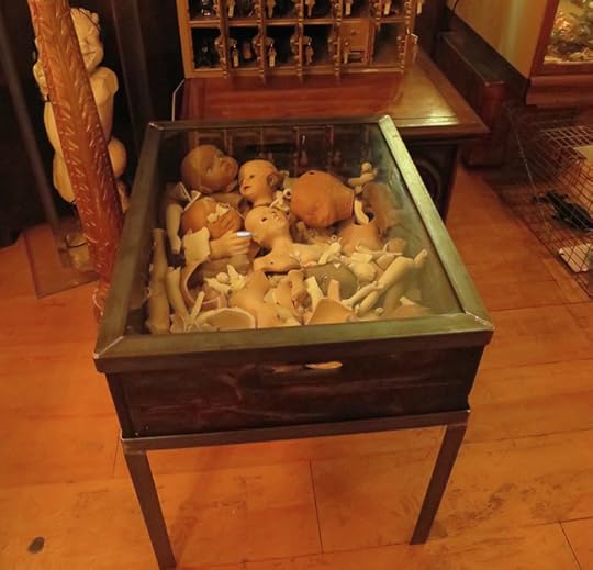 This lovely end table will certainly be a conversation piece. If your favorite topic is dismembered dolls, that is.