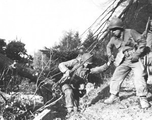 US soldiers struggling up a hill in the Hürtgen Forest. (US Army Center of Military History)