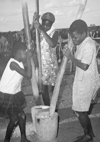 Making millet into flour. Photo by Rex Beam.