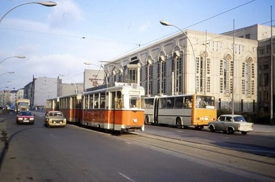 A 217 class REKO tram in Friedrichstrasse, route 46 from Niederschoenhausen to Friedrichsgracht, the turning circle in central Berlin shared with 25 and 49 route which also utilised the older style of tram. In the backgroud an articulated Ikarus bus of BVB. January 1990. photo by Felix O. CC BY-SA 2.0 via Wikimedia Commons.