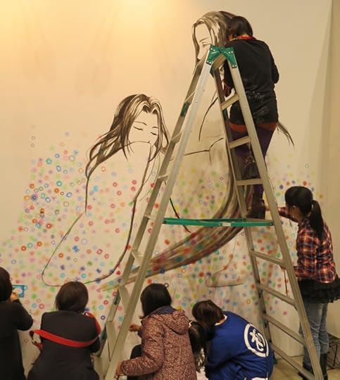 This mural features thousands of flowers, drawn on the spot with Spirographs.