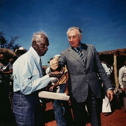 Prime Minister Gough Whitlam pours soil into the hands of traditional land owner Vincent Lingiari, Northern Territory