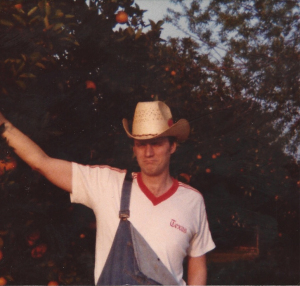 Me picking oranges in Mission, Texas