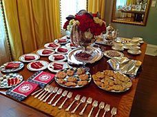 Alabama themed book club at Sheila Irby's home! Check out the Bama napkins and the little hound's tooth hats in the floral centerpiece.