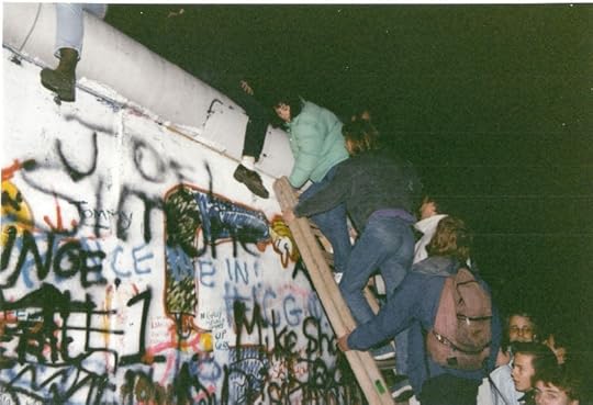 The fall of the Berlin Wall, November 1989. Photo by Gavin Stewart. CC BY 2.0 via gavinandrewstewart Flickr.