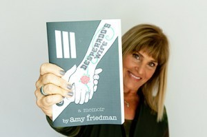 Amy Friedman holding book
