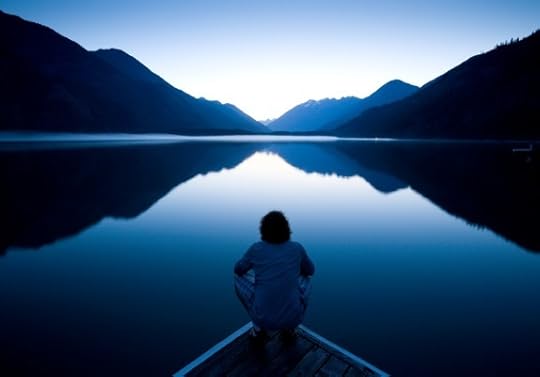 Person Sitting Quietly on the Edge of a Dock - Photo courtesy of ©iStockphoto.com/epicurean, Image #7706240