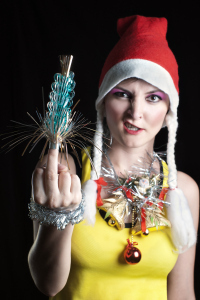 bigstock-Bad-Christmas-Girl-Showing-Mid-8068519