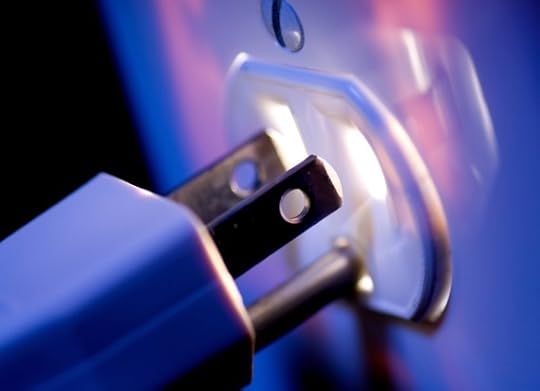 A Plug Being Inserted into a Glowing Socket - Photo courtesy of ©iStockphoto.com/gwmullis, Image #10093536
