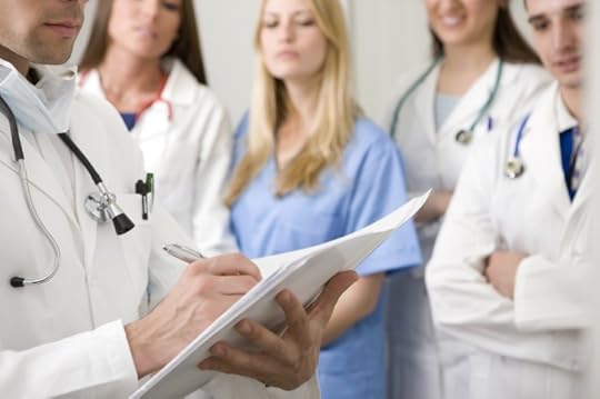 Doctor writing. © webphotographeer via iStock.