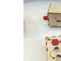 The Primo robot (back) and instruction board (front).