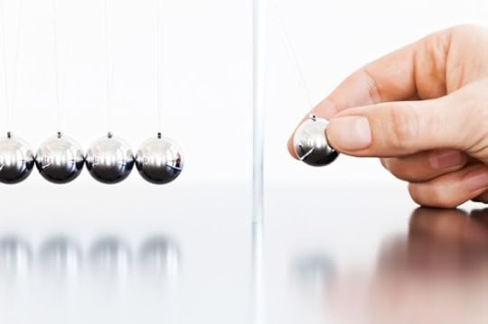 Newton’s Cradle with One Ball About to Be Dropped - Photo courtesy of ©iStockphoto.com/TommL, Image #17094436